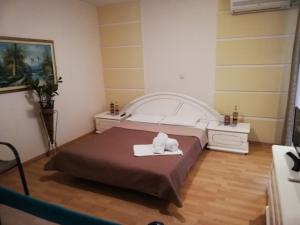 A bed or beds in a room at Sea Side Villa Economou