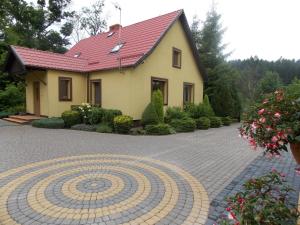 Ogród w obiekcie Domek pod Lasem na Mazurach