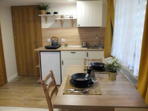 Kuchyňa alebo kuchynka v ubytovaní Apartamenty Milka