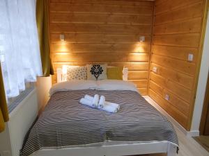 Posteľ alebo postele v izbe v ubytovaní Apartamenty Milka