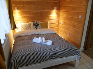 Posteľ alebo postele v izbe v ubytovaní Apartamenty Milka