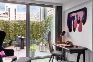
a living room filled with furniture and a window at Sea Containers London in London

