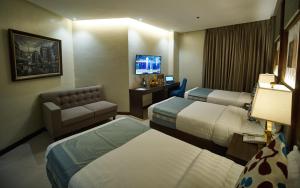 Postel nebo postele na pokoji v ubytování J7 Plaza Hotel + 15 fotografií