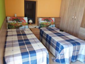 Postel nebo postele na pokoji v ubytování Villa Calendula