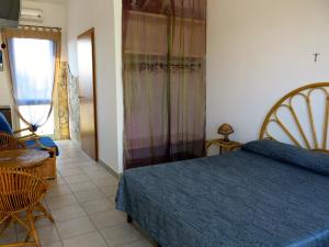 Posteľ alebo postele v izbe v ubytovaní Agriturismo Tenuta Del Morige