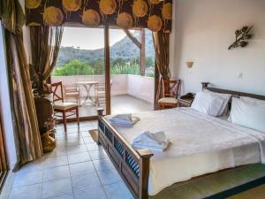 Postel nebo postele na pokoji v ubytování Luxury Villa Ioannis + 32 fotografií