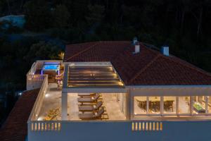 an aerial view of a house with a roof at Secret Escape Penthouse in Slatine