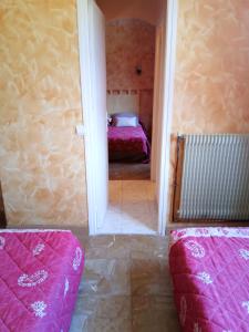 Postel nebo postele na pokoji v ubytování Hotel Font De Lauro