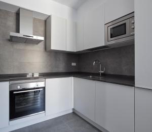 Kuchyňa alebo kuchynka v ubytovaní Muinoa 5 by FeelFree Rentals