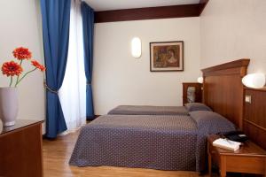 Postel nebo postele na pokoji v ubytování Hotel Bellevue