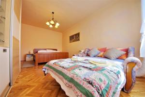 Posteľ alebo postele v izbe v ubytovaní Apartman Olive Garden + 36 fotografií