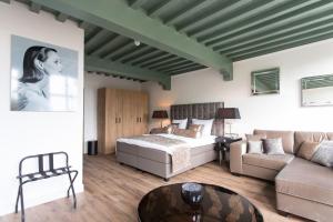 Katil atau katil-katil dalam bilik di Boutique Hotel Steenhof Suites - Adults Only