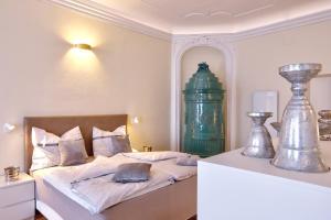 Łóżko lub łóżka w pokoju w obiekcie Stylische Cityapartments Benedikt