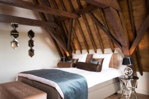Katil atau katil-katil dalam bilik di Boutique Hotel Steenhof Suites - Adults Only
