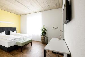 Postel nebo postele na pokoji v ubytování Partner Hotel AG Zofingen