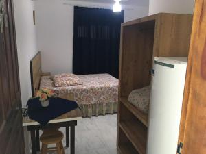 Postel nebo postele na pokoji v ubytování Pousada Maria Helena