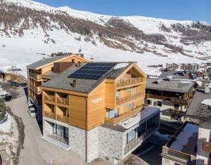 a house with solar panels on the roof at Montivas Lodge in Livigno