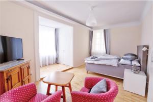Telewizja i/lub zestaw kina domowego w obiekcie Stylische Cityapartments Benedikt