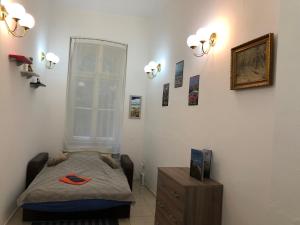 A bed or beds in a room at Urania