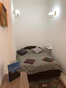 A bed or beds in a room at Urania