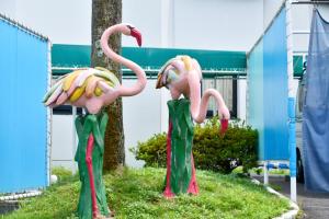 two fake flamingos with bananas on their necks at Nagasaki Chapel Coconuts Hotel ＆Resort in Isahaya