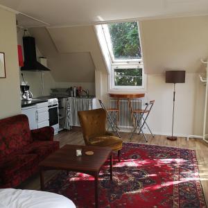 a living room with a couch and a table at Varbergs Vandrarhem in Varberg