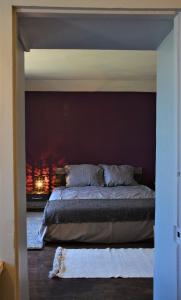 a bedroom with a bed and a fireplace at Auberge du Pont d'Ouche in Thorey-sur-Ouche