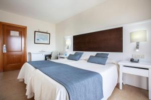 Ein Bett oder Betten in einem Zimmer der Unterkunft Grupotel Amapola