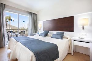 Ein Bett oder Betten in einem Zimmer der Unterkunft Grupotel Amapola