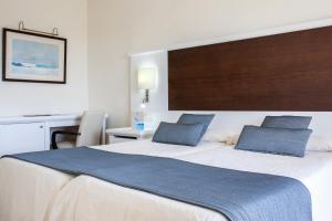 Ein Bett oder Betten in einem Zimmer der Unterkunft Grupotel Amapola