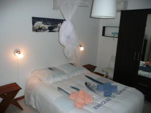 Postel nebo postele na pokoji v ubytování BUNGALOW DU VOYAGEUR
