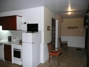 Kuchyň nebo kuchyňský kout v ubytování BUNGALOW DU VOYAGEUR