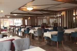 a row of tables and chairs in a restaurant at TEVETOGLU HOTEL in Istanbul
