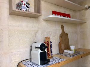 A kitchen or kitchenette at La `Ssuta