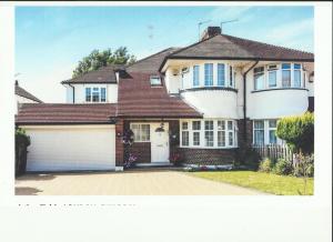 a large white house with a garage at Comfy Room Well Located in Crystal Palace
