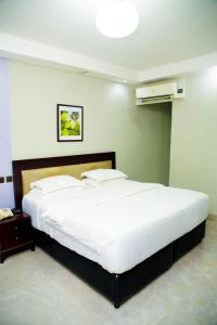 Ένα ή περισσότερα κρεβάτια σε δωμάτιο στο BW Starfire Hotel