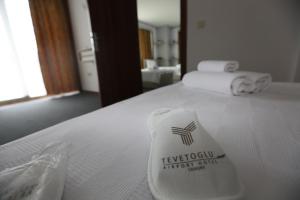a hotel room with a towel on a bed at TEVETOGLU HOTEL in Istanbul
