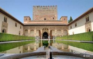 a building with a pool of water in front of it at Alejandra in Armilla