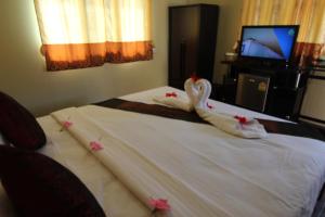Katil atau katil-katil dalam bilik di Phi Phi Ba Kao Bay Resort
