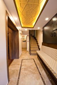 a hallway with stairs and a yellow ceiling at Kumluk Konak Hotel in Istanbul