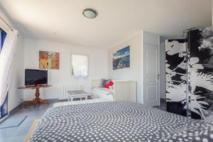 TV a/nebo společenská místnost v ubytování Appartement Océane