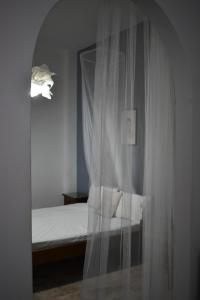 Postel nebo postele na pokoji v ubytování Poseidon Apartments