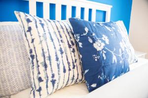 two pillows sitting on top of a bed at The Point Apartment, Leeds City Center in Leeds