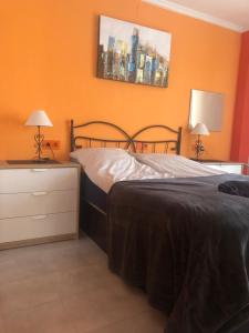 Łóżko lub łóżka w pokoju w obiekcie Gallud Apartament
