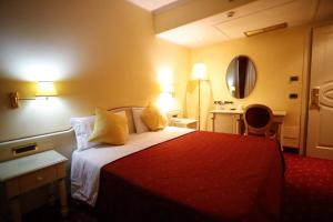 Postel nebo postele na pokoji v ubytování Grand Hotel Osman Ristorante il Danubio
