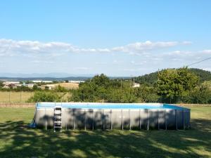a large swimming pool in a field in the grass at Agricampolungo Monterosi in Monterosi