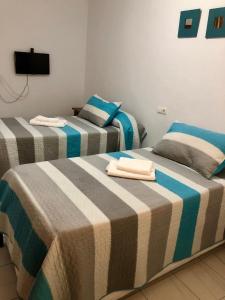 Cama o camas de una habitación en Ochomin Hostel