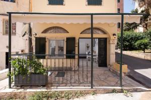 a gate in front of a house at the four seasons in Corfu