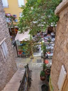 an overhead view of a patio with tables and trees at Old Town Point in Budva