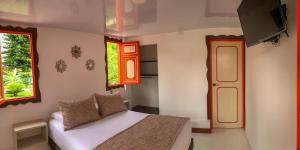 Lova arba lovos apgyvendinimo įstaigoje Hotel Terra Tacuara